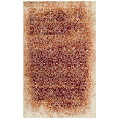 Tapis tissé à la machine en damas brun / orange / ivoire Fidalmo