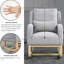 Fauteuil à bascule gris en tissu pour un salon confortable et rembourrage en mousse