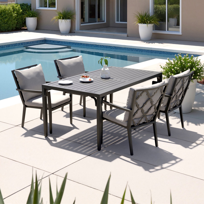 Calliann 4 - Person Patio Dining Set with Rectangular Table , Sunbrella® Cushions Included