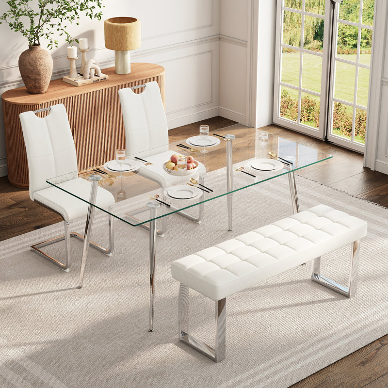 Ensemble de salle à manger en verre pour 4 à 6 personnes, de style moderne, comprenant une table de cuisine rectangulaire en verre, des chaises rembourrées en similicuir et un banc.