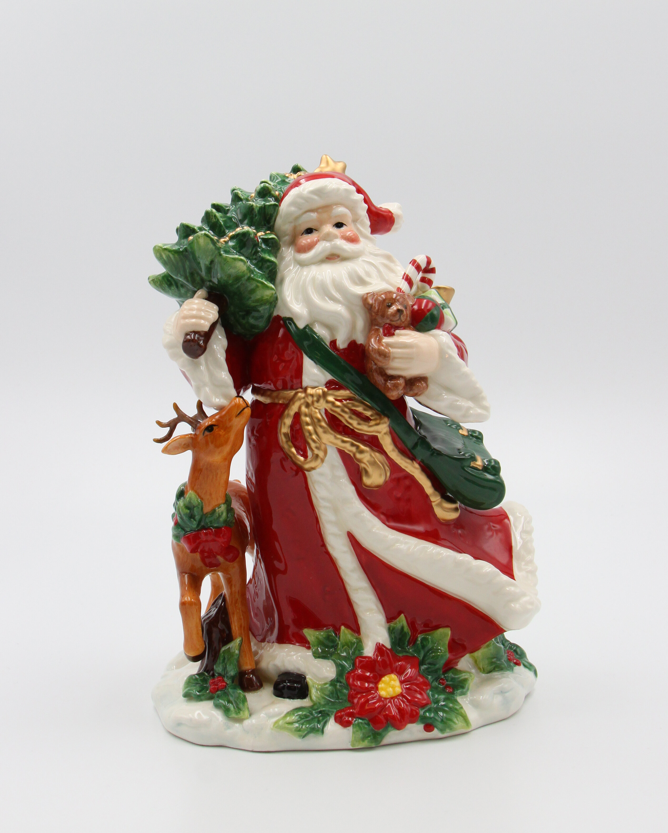 The Holiday Aisle® Santa With Reindeer Figurine | Wayfair