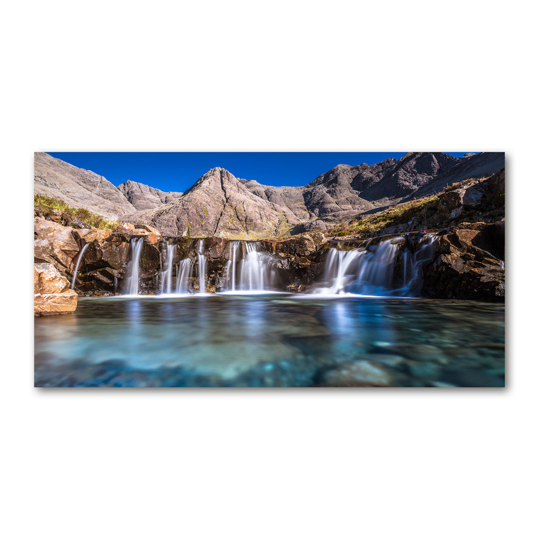 Glasbild Wasserfall in den Bergen