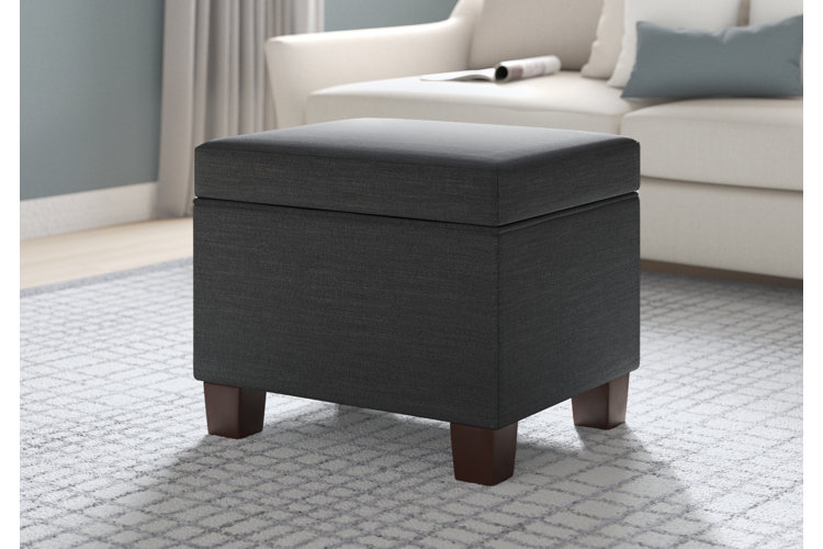 gray upholstered cube square ottoman with wood legs in a contemporary style living room with a white sofa top cube ottomans