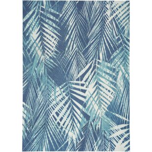 https://assets.wfcdn.com/im/73478150/resize-h310-w310%5Ecompr-r85/1822/182212654/waverly-sun-n-shade-floral-navy-area-rug.jpg