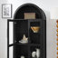 Une armoire de rangement arquée haute avec une lampe-2104173547