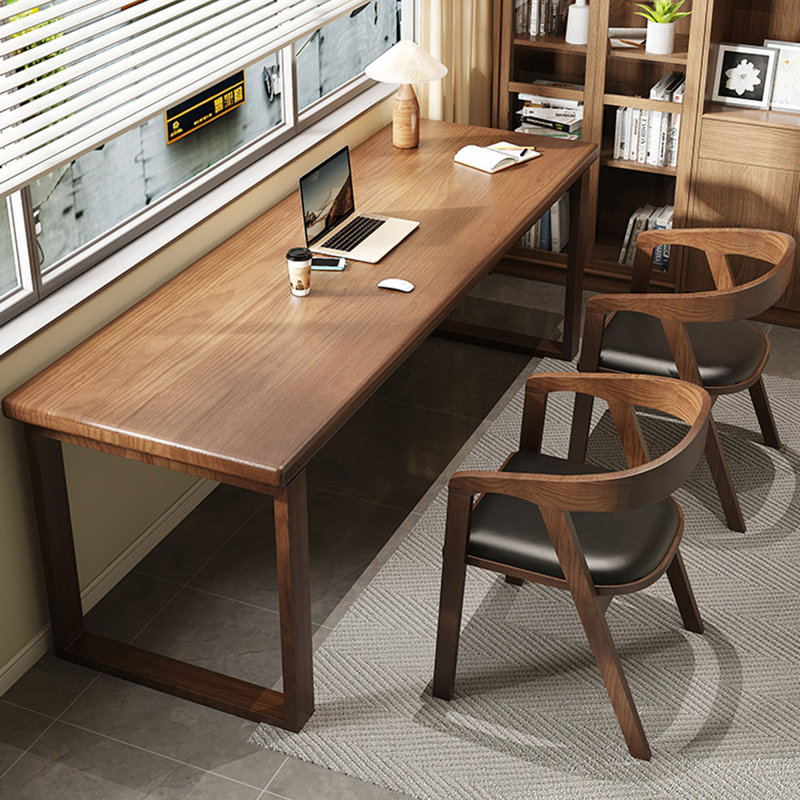 A simple rectangular solid wood desk in walnut color, 29.53" H x 62.99" W x 23.62" D