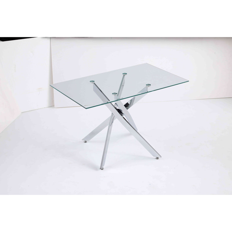 Le plateau de table rectangulaire moderne en verre trempé est jumelé à un cadre en fer