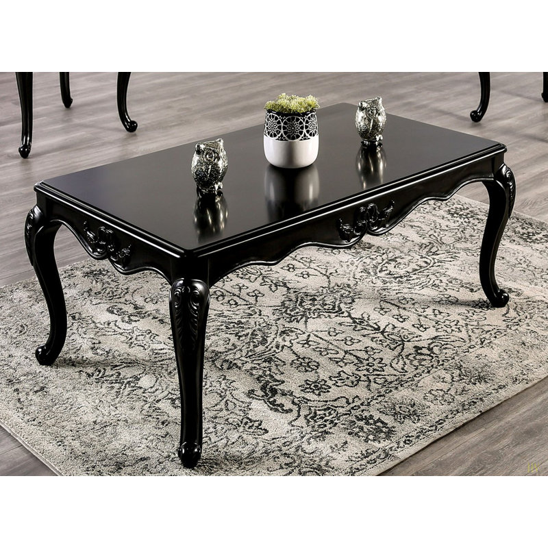 Table basse de style traditionnel avec pieds incurvés en bois massif
