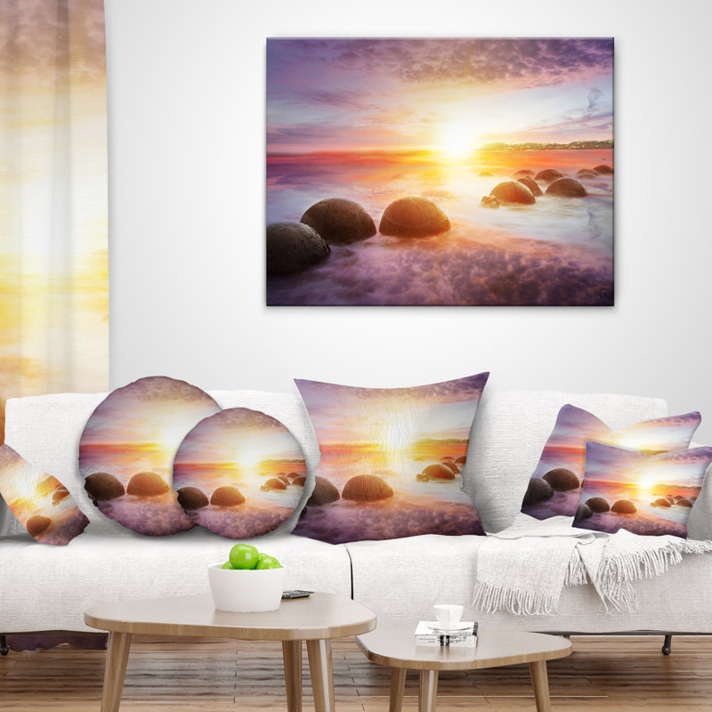 Housse de coussin rectangulaire en forme de soleil sur les rochers Moeraki