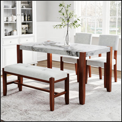 Ensemble de salle à manger quatre pièces avec plateau en faux marbre et sièges rembourrés pour espaces de vie modernes et compacts