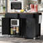Îlot de cuisine de 136 cm (53,5 po) avec abattant rabattable, 2 prises de courant, ports, 4 portes, tiroirs et 5 roulettes universelles, fini noir, aspect bois, salle à manger