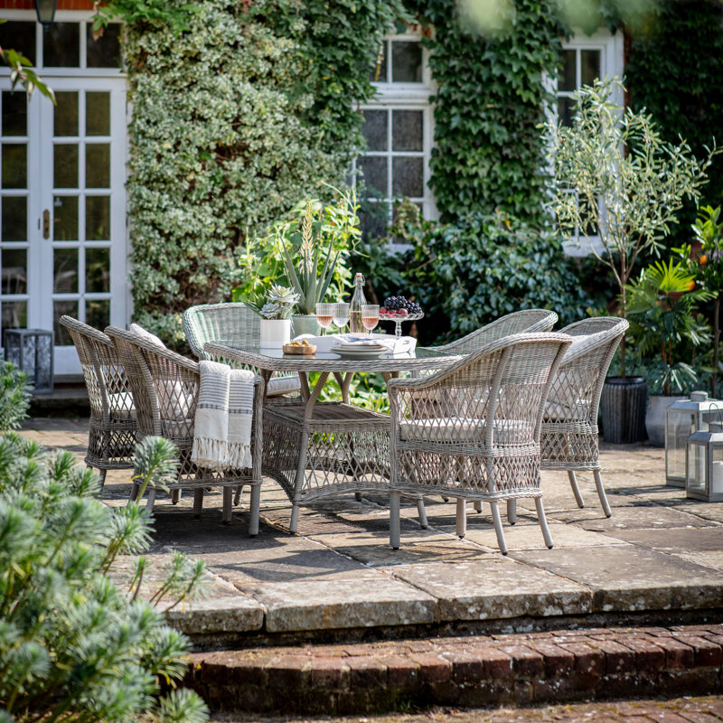 Vallo 6 - Person Patio Dining Set with Oval Table , Cushions Included