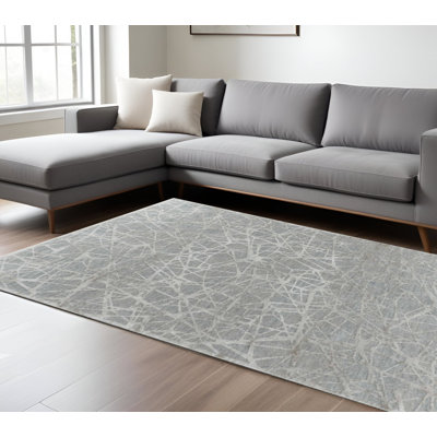 Tapis turquoise 8 pi x 10 pi à motif abstrait tissé à la machine