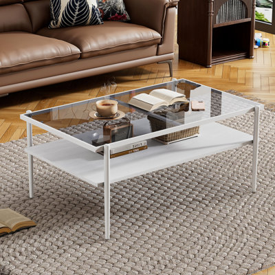 Élégante table basse avec plateau en verre trempé gris et pieds de salon rectangulaires blancs fiables: