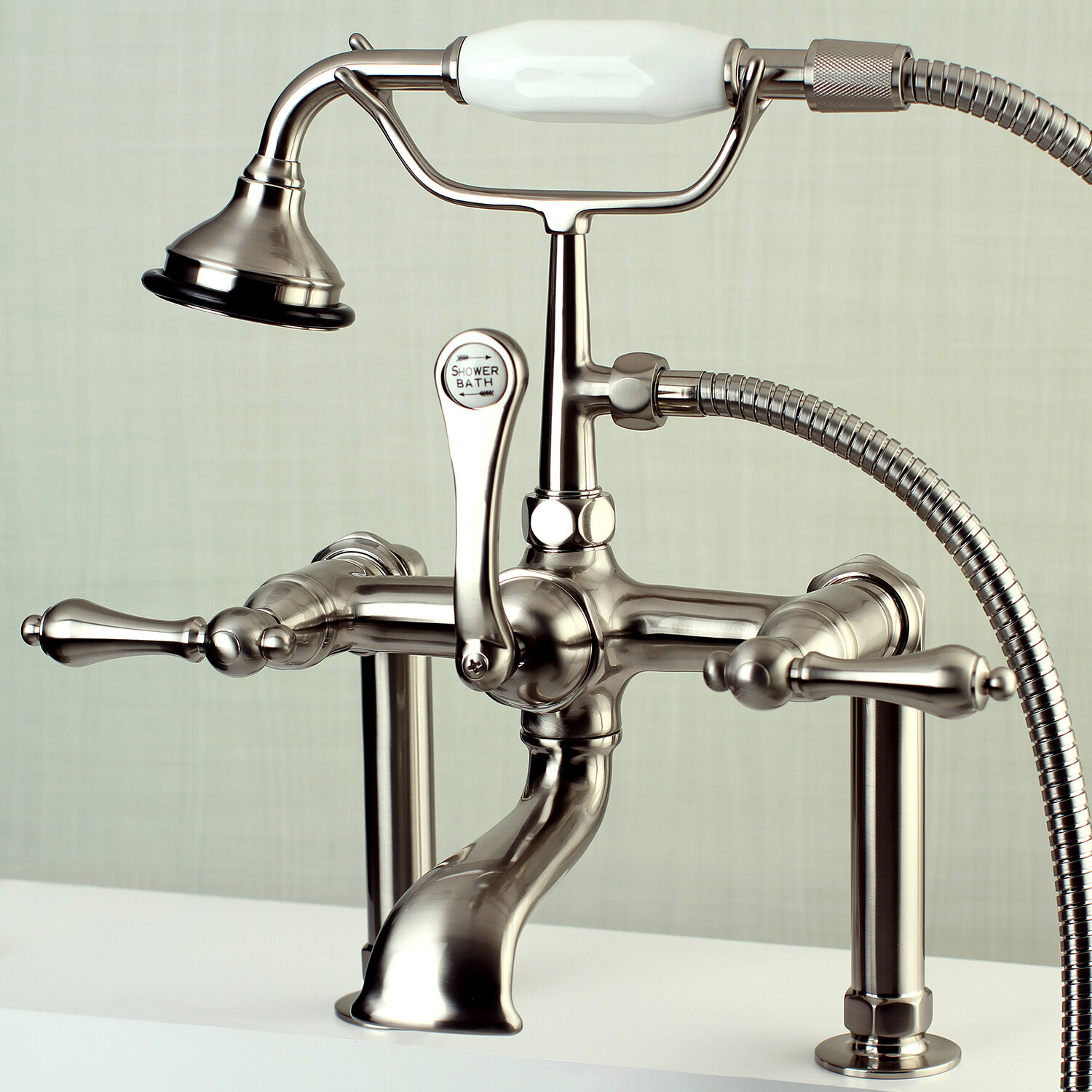 https://assets.wfcdn.com/im/73564394/compr-r85/1731/17310095/vintage-triple-handle-deck-mounted-clawfoot-tub-faucet-trim-with-diverter.jpg