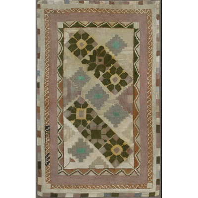 Tapis antique crocheté à losanges