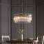 Geira Grand 7lt Pendant light finished in Ant. Brass