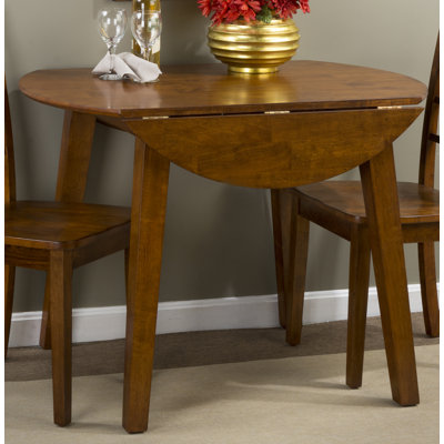 Iyad Extendable Round Solid Wood Dining Table