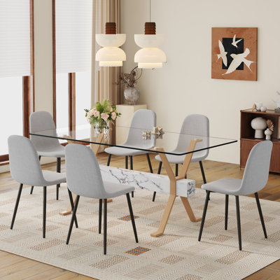 Ensemble de table et de chaises. Table de salle à manger élégante en verre trempé transparent - 71 po x 35,4 po avec chaises en tissu de lin et pieds en métal. Grande table avec pieds en métal de couleur bois en forme de X.