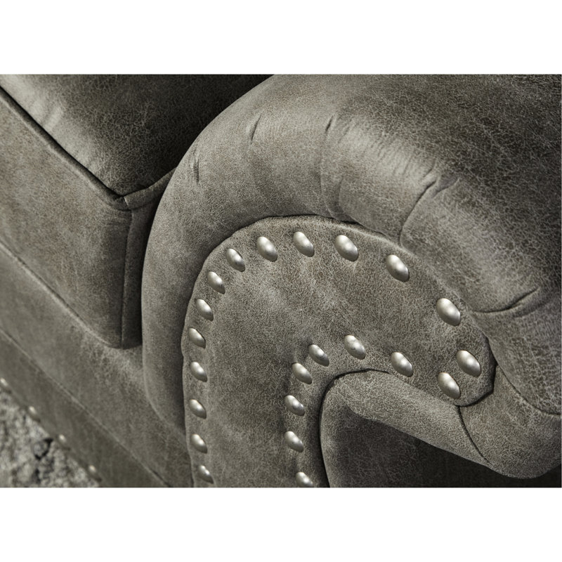 Chaise grise en similicuir gris avec magnifique coussin de dossier dans des matériaux de qualité