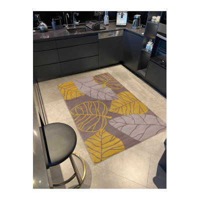 Tapis tissé à motif de feuilles