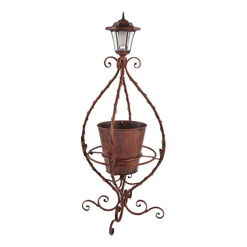 Pot de fleurs antique en fer forgé avec lumière solaire, Bronze