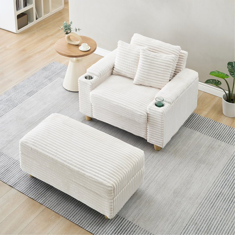 Canapé simple en velours côtelé avec un coussin, deux coussins décoratifs, un repose-pieds et deux espaces de rangement.