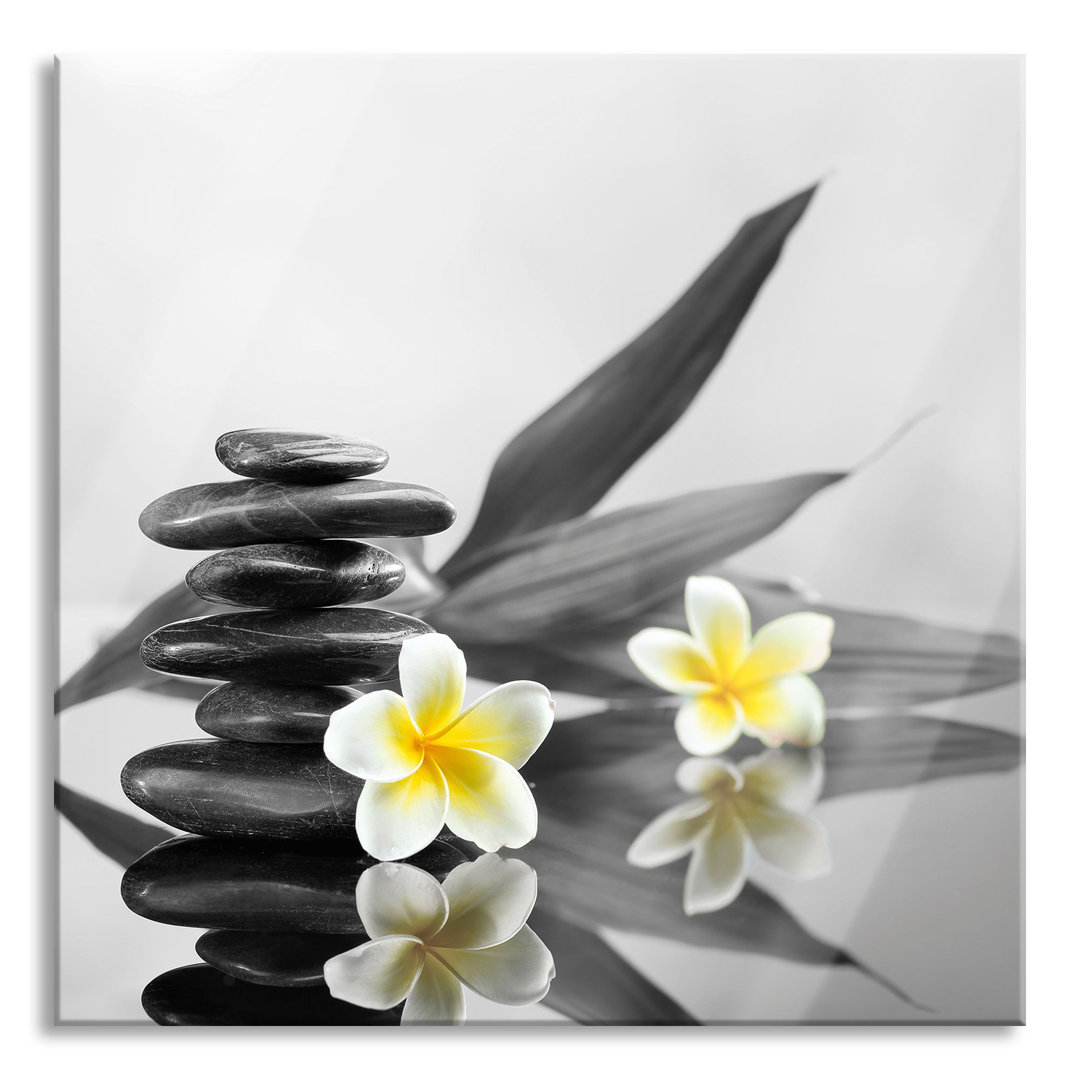 Glasbild Monoi Flowers und Zen Stone Tower