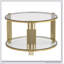 Table basse moderne en verre avec structure asymétrique en métal et base cylindrique, parfaite pour les espaces de vie contemporains