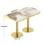 Table de salle à manger Tulipe, plateau en pierre frittée avec impression luxueuse imitation marbre, piètement en acier inoxydable, surface résistante aux égratignures et à l'usure, imperméable, convient aux restaurants aménagés.