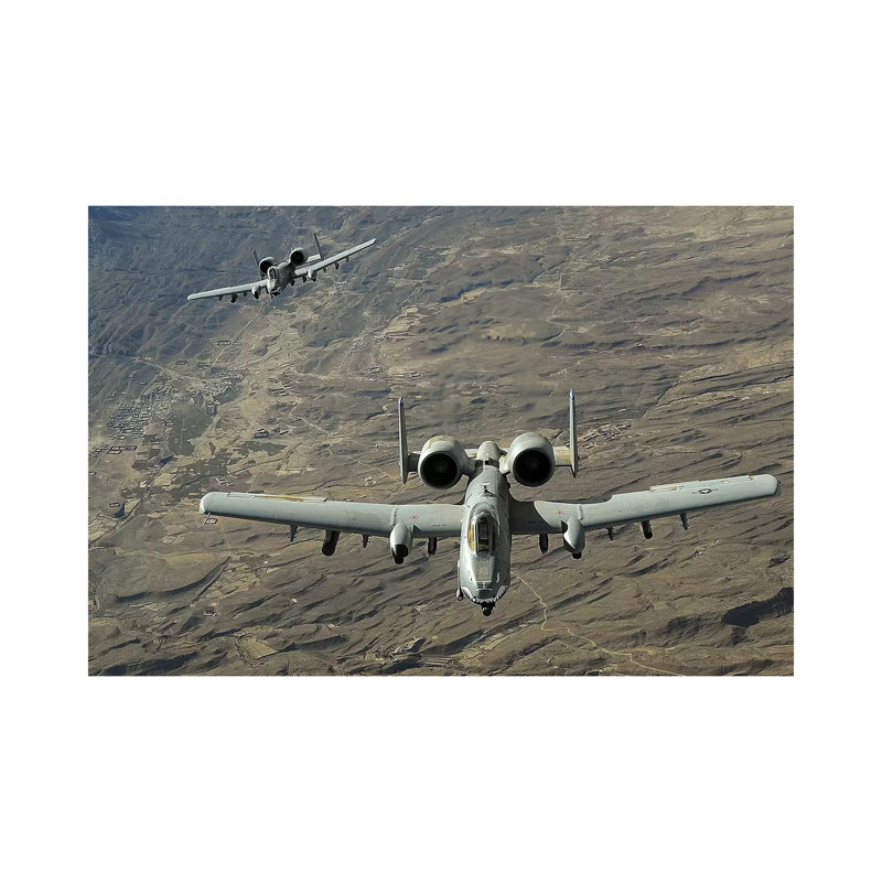 A Two-Ship A-10 Thunderbolt II Formation Flies A Combat Mission Over Afghanistan by Stocktrek Images - Wrapped Canvas Print
