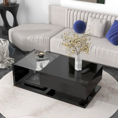 Table basse noire avec tiroir et plateau ouvert en verre trempé