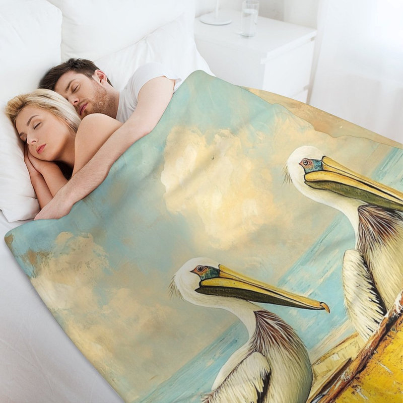 Deux pélicans en jeté de flanelle de luxe en mer, 50 x 60 po