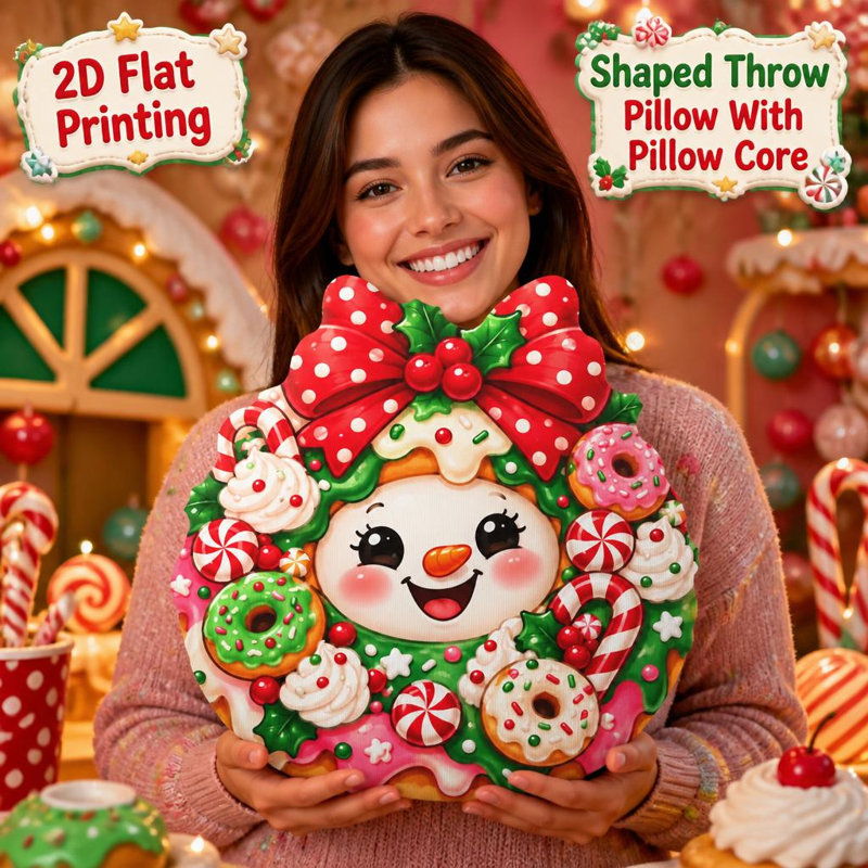 Coussin décoratif en peluche imprimé en 2D, motif bonhomme de neige avec couronne, beignes et cannes de Noël. 55 cm., 55 cm