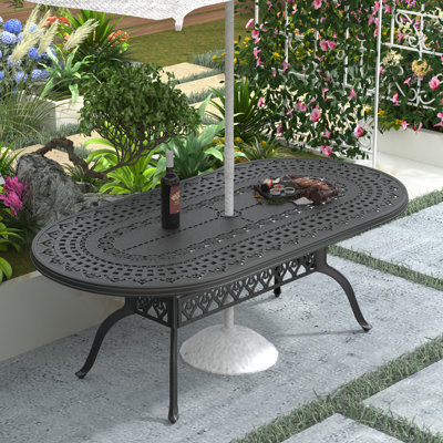 Andreca Cast Aluminum Patio Dining 81.89'' L x 41.34'' W Oval Table with a 1.88-inch Umbrella Hole