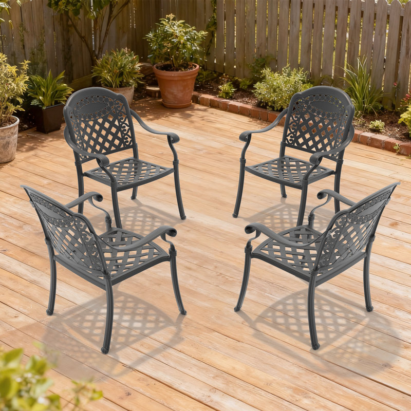 Ensemble de 4 chaises de jardin en aluminium moulé, structure noire, coussins rouges, motifs pétales raffinés, revêtement, assise confortable, empilables pour plus de commodité, résistantes aux intempéries et aux UV, en nylon PA66 antidérapant.