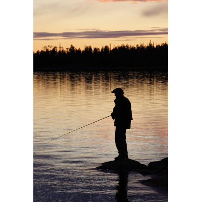 Silhouette Of A Man Fishing At Dusk by Inok - No Frame Art Prints on Canvas