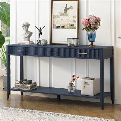 Élégante console d'entrée avec tiroirs à rayures verticales et pieds longs, idéale pour organiser et rehausser tout espace