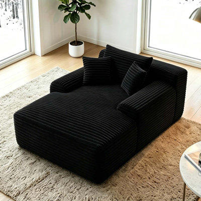 Fauteuil-lit convertible sans os avec larges accoudoirs et coussins décoratifs