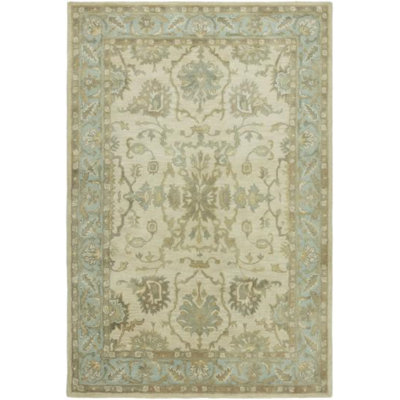 Tapis ivoire / bleu clair en laine touffeté à la main à motif floral