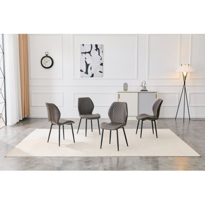 Ensemble de 4 chaises en polyuréthane matelassées modernes gris clair et luxueuses avec pieds en métal noir