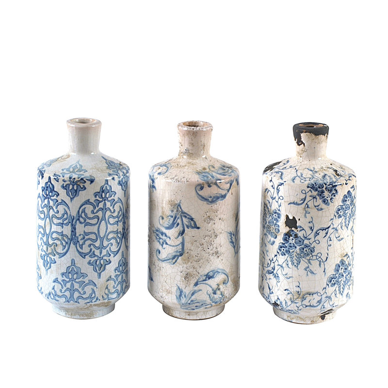 Divers vases décoratifs en terre cuite avec une finition à motif