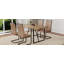 Ensemble de table et de chaises. Une table de salle à manger rectangulaire rétro minimaliste avec un plateau texturé et des pieds en métal.-936666420