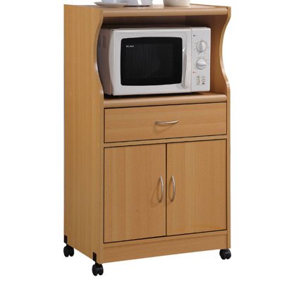 Rolling Kitchen Cart with Microwave Shelf, Utensil Drawer, Interior Cabinet Storage Space and Locking Wheels by L