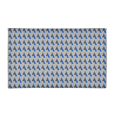 Tapis gris/bleu à flèches décalées