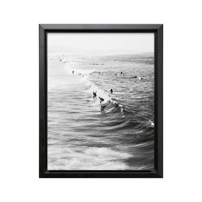 Surfers Riding Waves