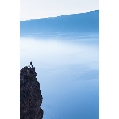 Hiker Looks At The View Of The Crater Lake by Deimagine - Wrapped Canvas Print