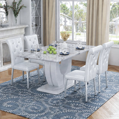 Ensemble de table de salle à manger moderne en faux marbre de 63 po avec chaises en similicuir à ressorts