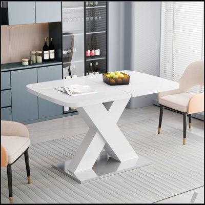 Table de salle à manger moderne carrée avec plateau blanc extensible et pieds en MDF durables en X, parfait pour une salle à manger polyvalente