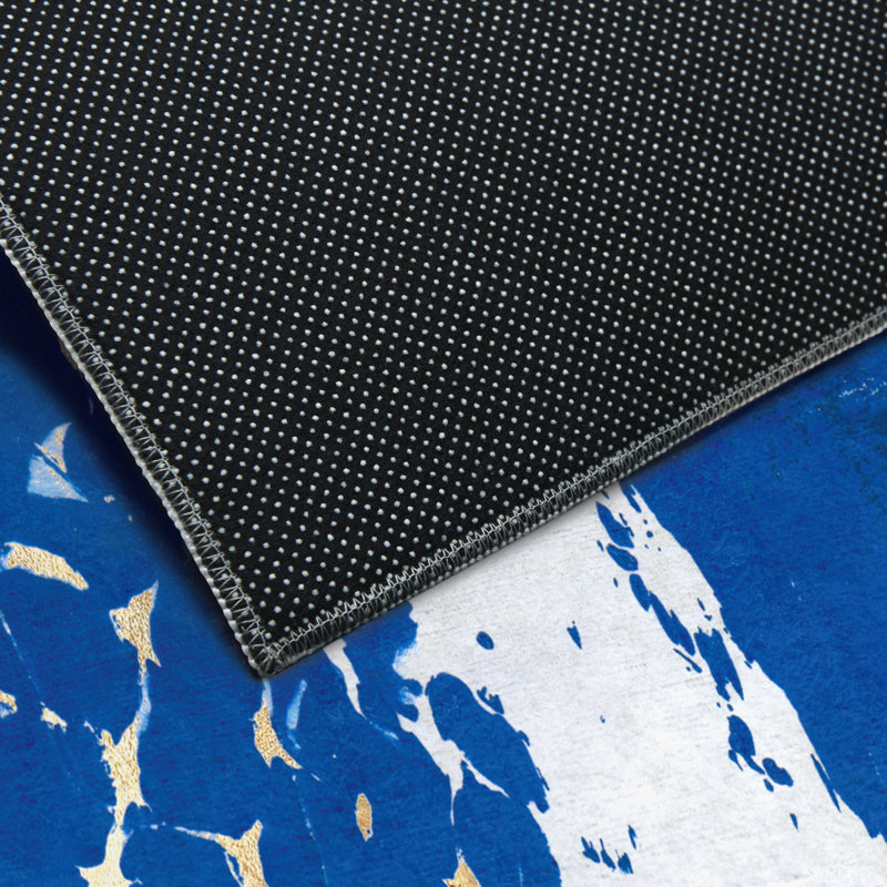 Tapis rectangulaire Divyan avec envers antidérapant